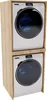 A stacked washing machine and dryer unit within a wooden frame. Produktbild-Vorschau