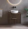A modern bathroom vanity with a vessel sink and a round illuminated mirror. Voir les images du produit