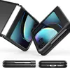 Two black flip phone cases are shown in a diagonal view, with a third view of the cases from the side at the bottom. The phone screens inside the cases display a colorful abstract image. Produktbild-Vorschau
