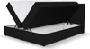 A black boxspring bed with its storage compartment open, revealing the mattress inside. Voir les images du produit