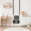 A baby swing and play kitchen set up in a child's room. Produktbild-Vorschau