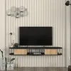 A modern TV lowboard mounted on a wall with a television and decorative items. Podgląd zdjęcia produktu