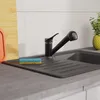 A kitchen sink with a black faucet and a sponge. Náhled obrázku produktu