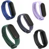 Five different colored replacement bands for a smart watch are displayed against a white background. Voir les images du produit