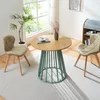 A round dining table with two chairs in a bright room with a large window. Náhľad obrázku produktu