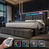 A modern bedroom with a bed featuring LED lighting and storage drawers, showcasing various features like a remote control and power outlets. Náhľad obrázku produktu
