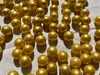 Nahaufnahme goldener 16 mm Glasmurmeln mit glänzender Glasoberfläche und edler Goldoptik. Produktbild-Vorschau