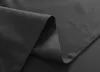 A close-up of dark gray fabric, showing the texture and stitching of a curtain. Produktbild-Vorschau