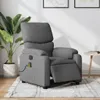 A gray massage recliner chair is shown in a room with a plant and a side table.