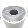 Top view of a white air purifier with a black digital display on a white background. Produktbild-Vorschau