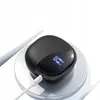 A black charging case for wireless earbuds is shown on a white charging pad, connected by a white USB cable. Produktbild-Vorschau