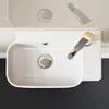 A top-down view of a white ceramic sink with a silver faucet and drain. Anteprima dell’immagine prodotto