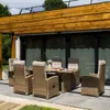 An outdoor dining set on a patio with a modern wooden pergola overhead. Náhled obrázku produktu