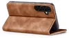 A brown leather flip case for a smartphone is shown from a diagonal angle, with the front cover open. Produktbild-Vorschau
