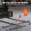 A person is using a magnetic sweeper attached to a forklift to collect screws and other metal debris from a concrete floor in a warehouse. Náhľad obrázku produktu