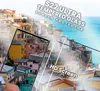 A scenic view of colorful buildings on a hillside overlooking the ocean, with two smartphone screen protectors superimposed. Produktbild-Vorschau