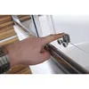 A hand is shown adjusting a roller mechanism on a shower enclosure. Produktbild-Vorschau