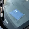 A blue packet is placed on a car windshield. Anteprima dell’immagine prodotto
