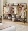 A clothing rack with various garments and shoes displayed. Produktbild-Vorschau