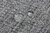 Close-up of water droplets on a textured gray surface, possibly carpet or fabric. Produktbild-Vorschau