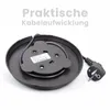The underside of a black electric kettle base with the power cord coiled and plugged into the base. Produktbild-Vorschau