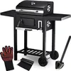 A black charcoal grill with a lid, side shelf, and storage rack, shown with accessories like a glove, mat, and brush. Produktbild-Vorschau