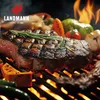 A close-up shot of a steak and vegetables being grilled over flames. Voir les images du produit