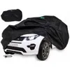A black car cover is draped over a white toy car. Produktbild-Vorschau