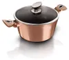 A rose gold pot with a black speckled lid and silver accents, set against a white background with a reflection. Podgląd zdjęcia produktu