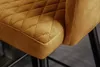 A close-up view of the quilted seat of a bar stool. Produktbild-Vorschau