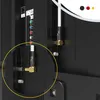 Close-up view of the back panel of a television, showing various ports and connectors, with an antenna cable plugged into one of the ports. Produktbild-Vorschau