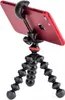 A red smartphone is mounted on a black flexible tripod. Náhled obrázku produktu