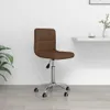 A brown fabric office chair with a silver base and wheels, shown in a room with a white wall and light wooden floor. Náhľad obrázku produktu