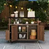 An outdoor patio setting with a wooden serving cart filled with kitchenware and groceries. Produktbild-Vorschau