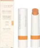 A product shot of a concealer stick and its packaging. Produktbild-Vorschau