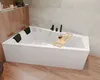 A modern bathroom with a white bathtub, wooden accents, and marble-like tiles.