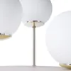 A close-up view of a multi-light ceiling lamp with white spherical shades and gold and silver accents. Produktbild-Vorschau