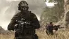 Two soldiers in tactical gear in a dry, mountainous environment. Produktbild-Vorschau