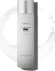 A bottle of Tirtir Milk Skin Toner Light is shown against a white background with a splash of milk effect. Náhled obrázku produktu