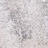 A close-up, textured view of a carpet with an abstract pattern. Produktbild-Vorschau