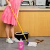 A person is cleaning a floor with a mop and cleaning solution. Voir les images du produit