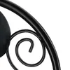 A close-up view of a black metal scrollwork detail, likely part of a decorative item like a plant stand or screen. Náhľad obrázku produktu