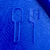 A close-up of a blue plastic spoon and fork outline on a textured blue surface. Produktbild-Vorschau