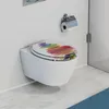 A wall-mounted toilet with a colorful stone-patterned toilet seat in a modern bathroom. Náhled obrázku produktu