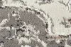 A close-up view of a textured rug with a patterned design. Voir les images du produit