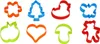 A collection of eight colorful plastic cookie cutters arranged in two rows of four. Podgląd zdjęcia produktu