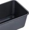 A close-up view of the interior of a dark-colored loaf pan. Náhled obrázku produktu