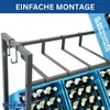 A close-up view of a metal beverage crate rack holding blue plastic crates filled with bottles. Náhled obrázku produktu