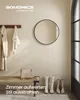 A hallway with a mirror, bench, coats, and boots. Produktbild-Vorschau