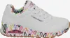 A side view of a white Skechers sneaker with a colorful heart pattern on the sole and inner lining. Náhled obrázku produktu